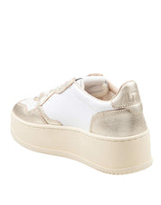 AUTRY LOW-TOP PLATFORM LEATHER SNEAKERS IN WHITE AND GOLD