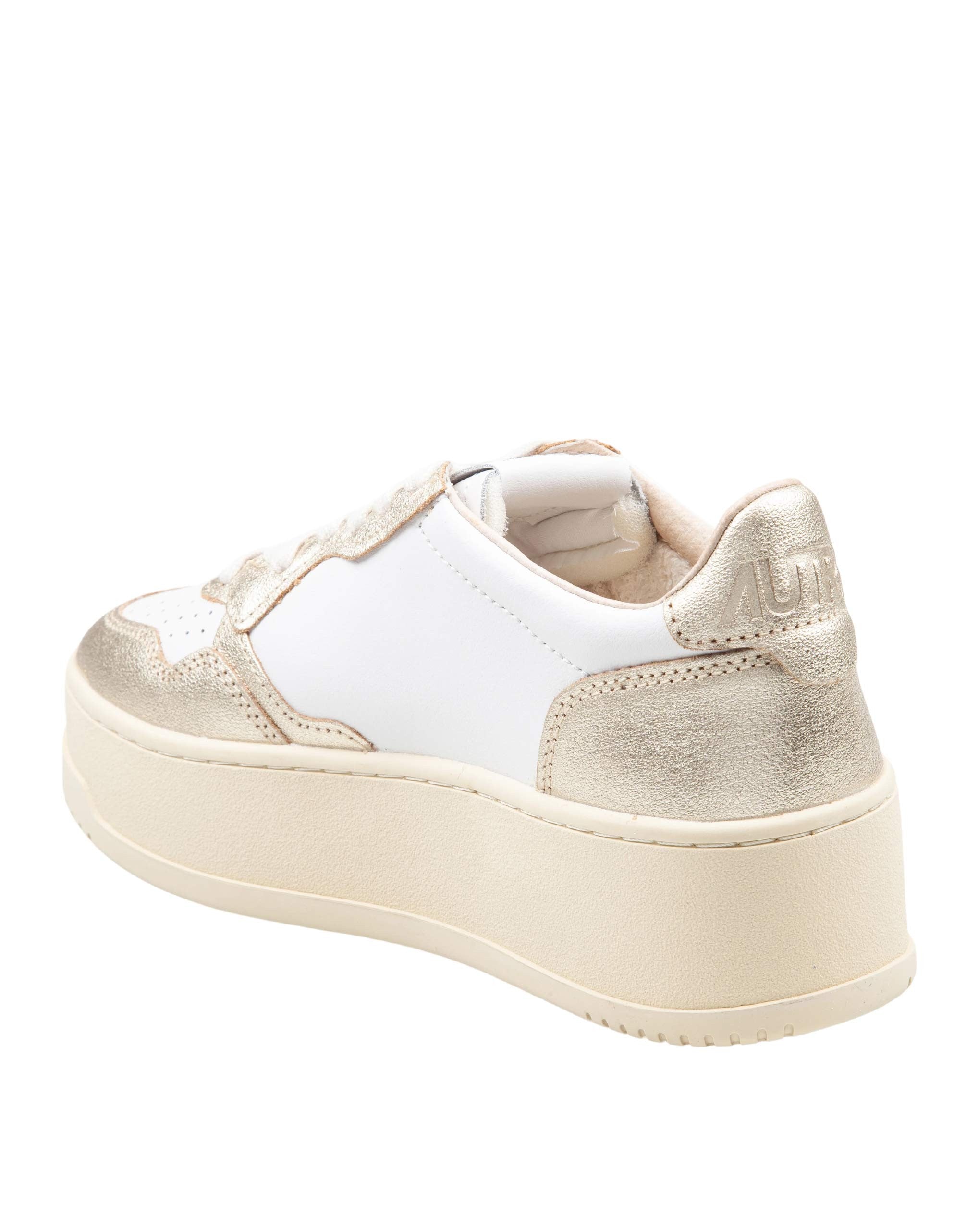 AUTRY LOW-TOP PLATFORM LEATHER SNEAKERS IN WHITE AND GOLD