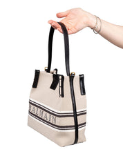 BALMAIN RELEASE CANVAS AND LEATHER BUCKET BAG WITH LOGO