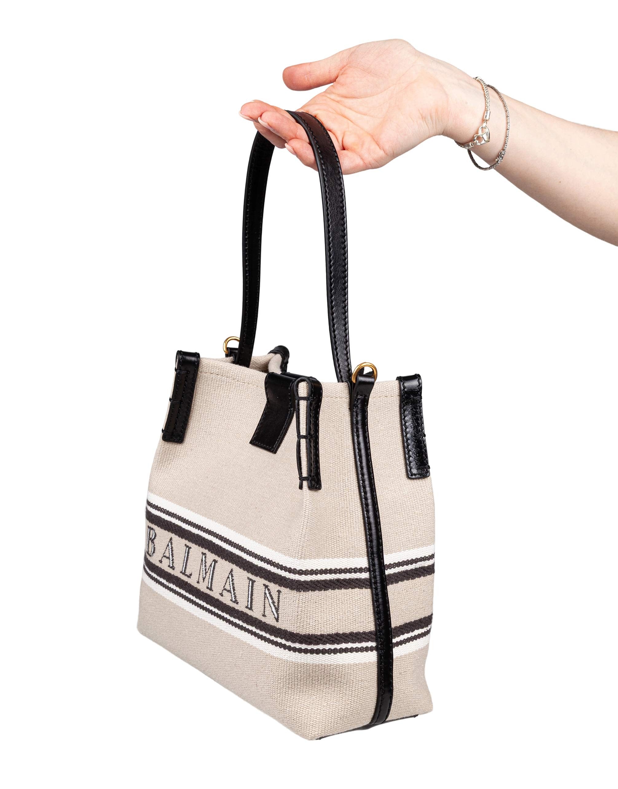 BALMAIN RELEASE CANVAS AND LEATHER BUCKET BAG WITH LOGO